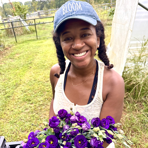 Victoria Edwards-Cotten with a handful of lisianthus